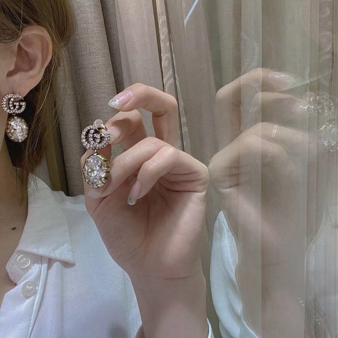 G u c c I earrings