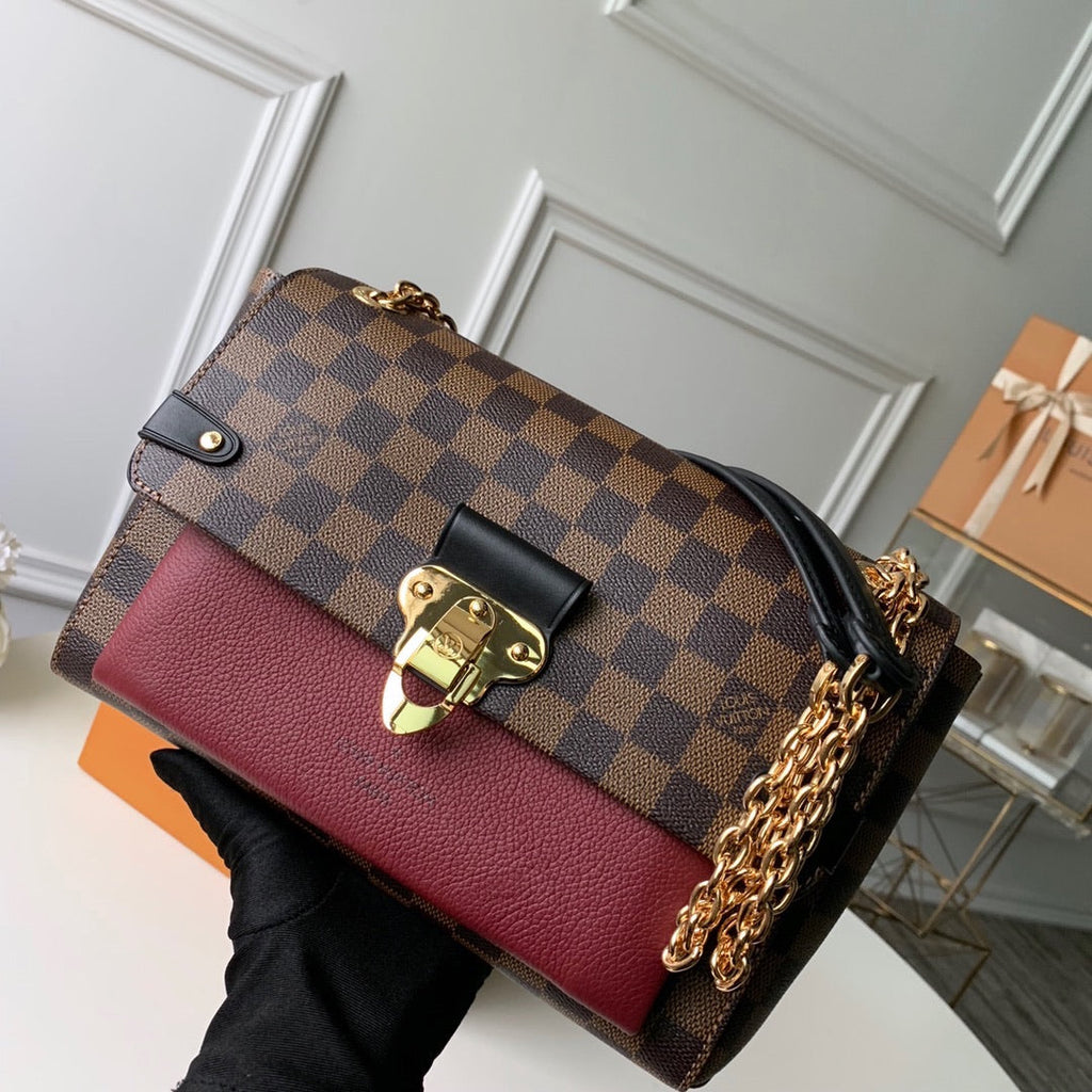 Metal latch handbag
